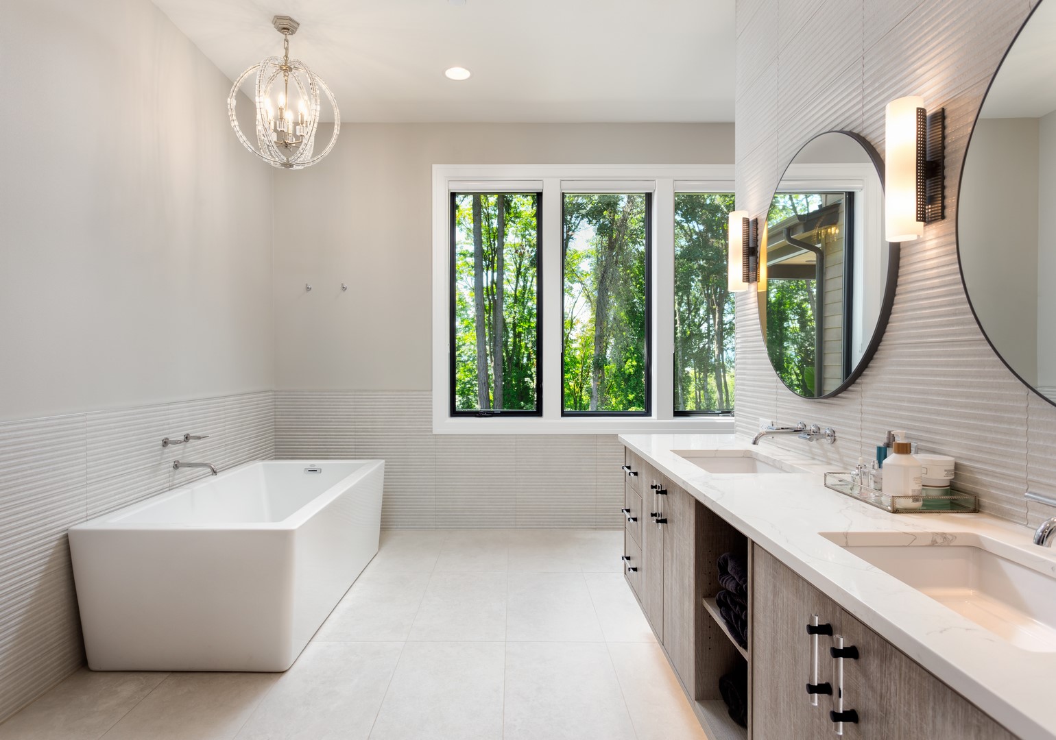 Elegant bathroom in new luxury home with two sinks and bathtub